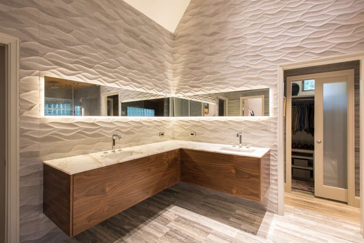 floating walnut vanity in master bathroom of dallas whole house remodel